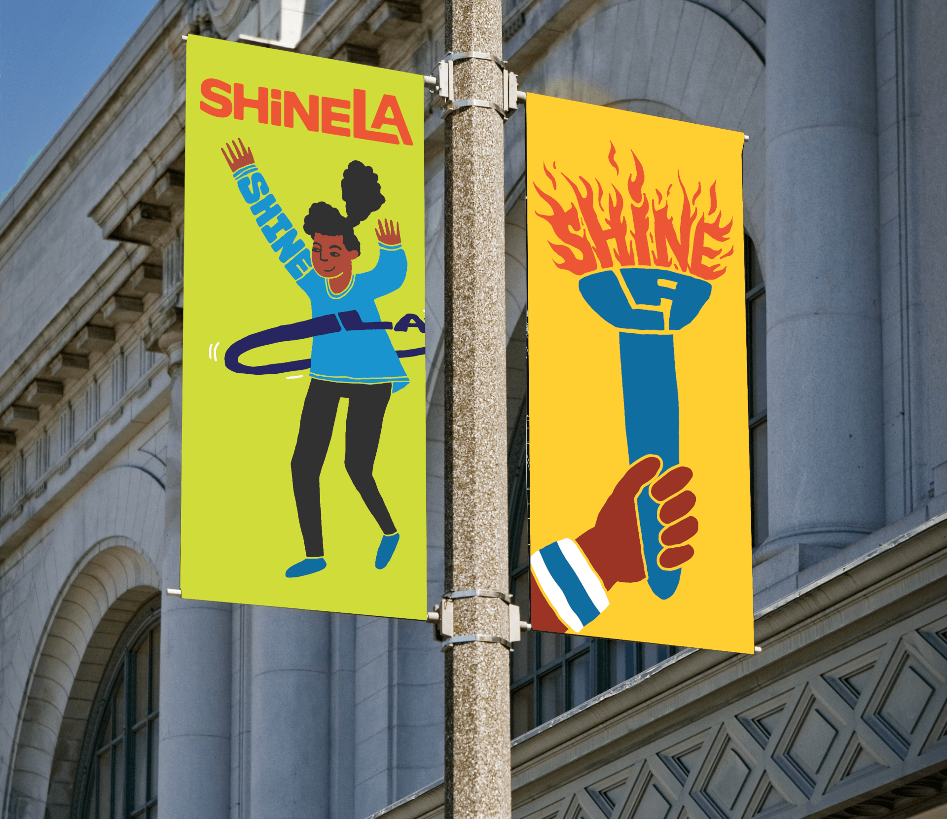 ShineLA Art posters on a light post, left: a girl with a hula hoop aroudn their waist, right: torch